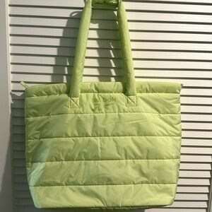 NWOT Reebok Quilted Tote with inside zippered pocket and zip closure.